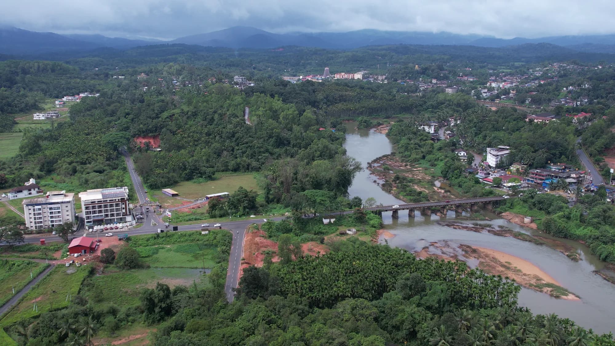 The Tunga River flowing through the green landscape of Sringeri